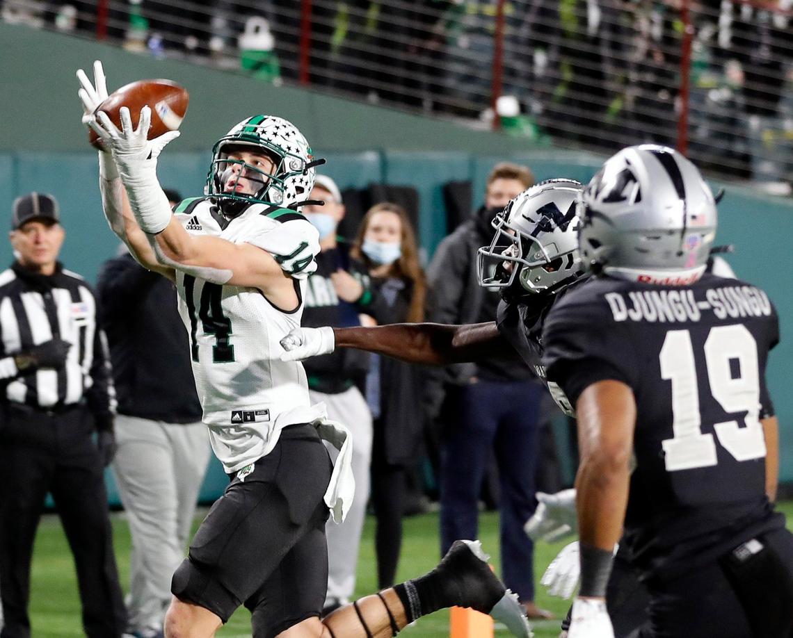 Southlake Carroll’s Brady Boyd (14) hauls in their second touchdown during a Conference 6A Division 1 regional playoff football game at Globe Life Park in Arlington, Texas, Friday, Dec. 24, 2020. Southlake Carroll led Arlington Martin 17-11 at the half. (Special to the Star-Telegram Bob Booth)
