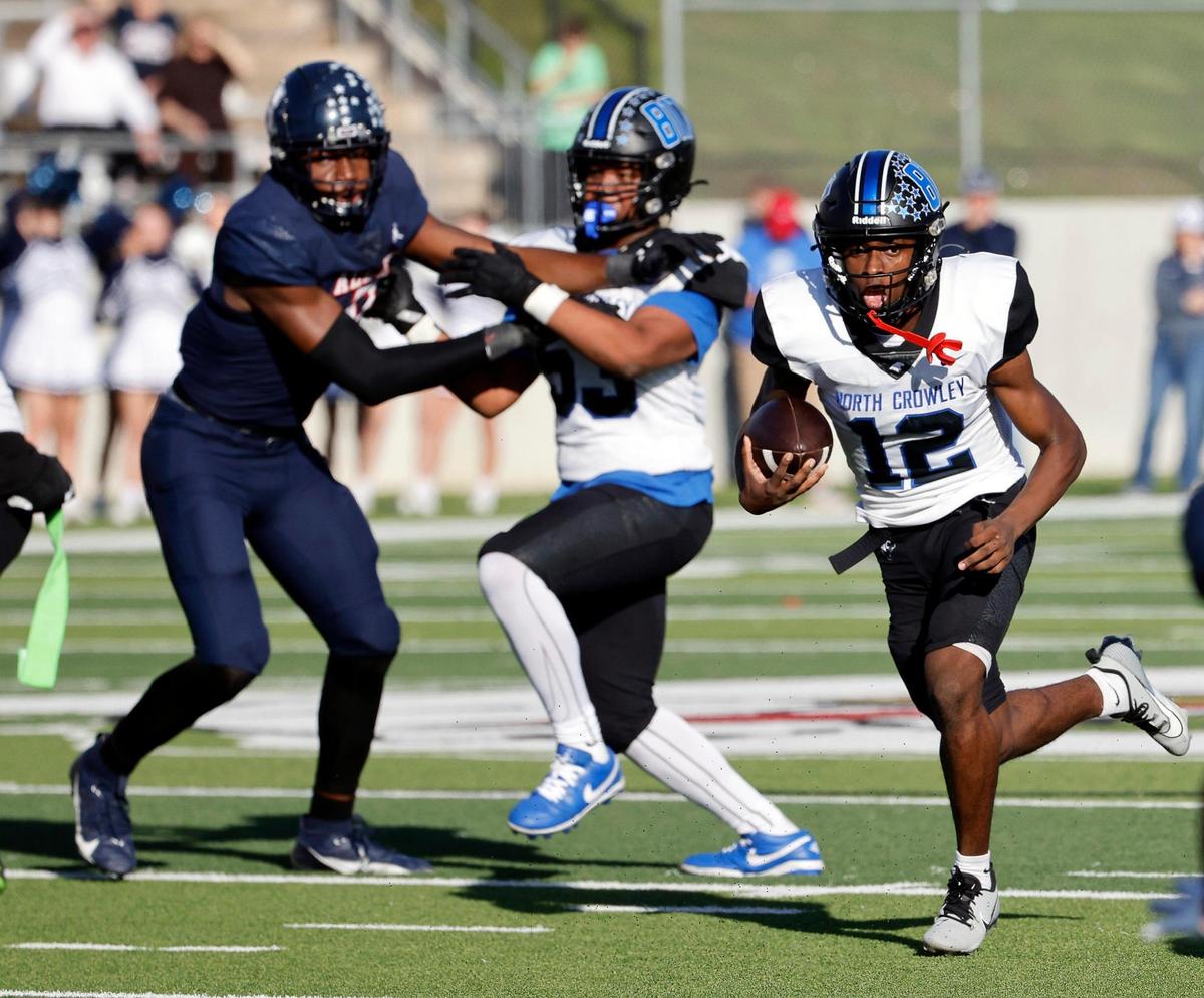 North Crowley quarterback Chris Jimerson (12) finds a hole for a touchdown during the second half of a UIL Conference 6A Division 1 quarterfinal football playoff game at Dragon Stadium in Southlake, Texas, Saturday, Dec. 02, 2023.