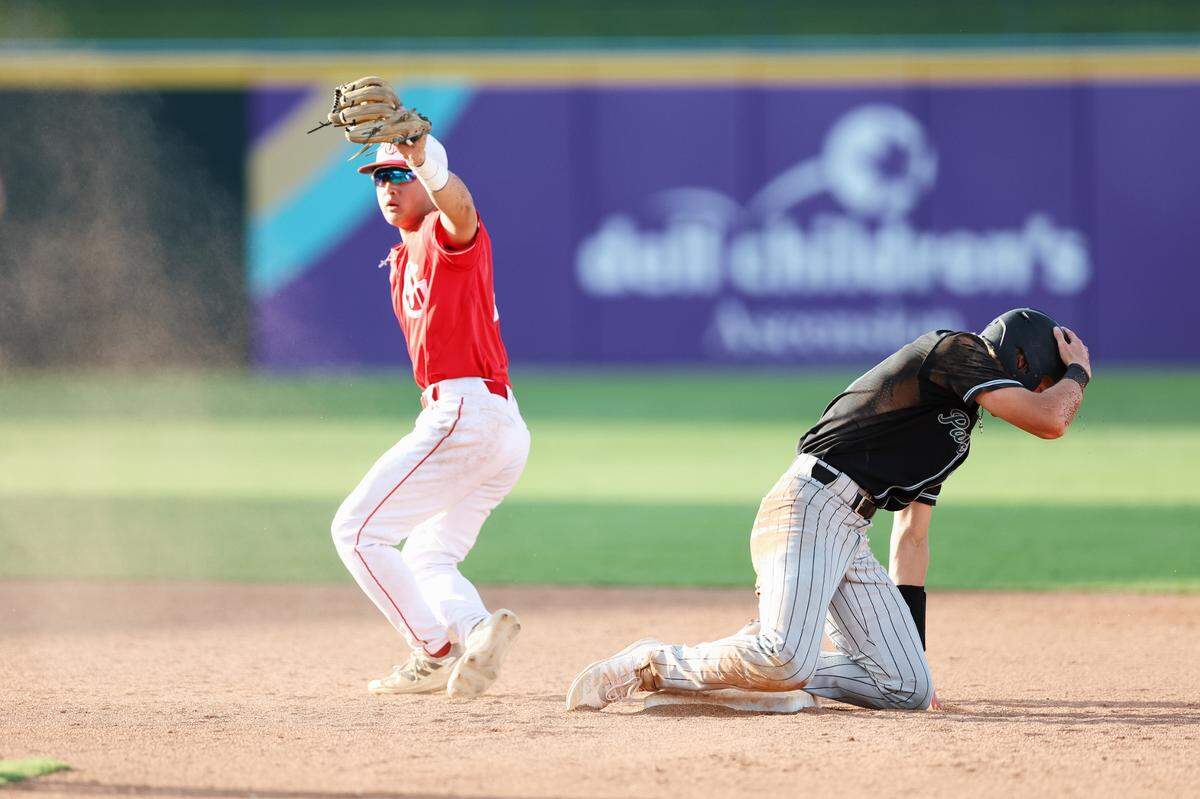 Grapevine second baseman Colin Park holds his glove in the air after tagging out a Kingwood Park runner in the Class 5A Division II state championship game on Friday, June 6, 2025 at Dell Diamond in Round Rock, Texas.