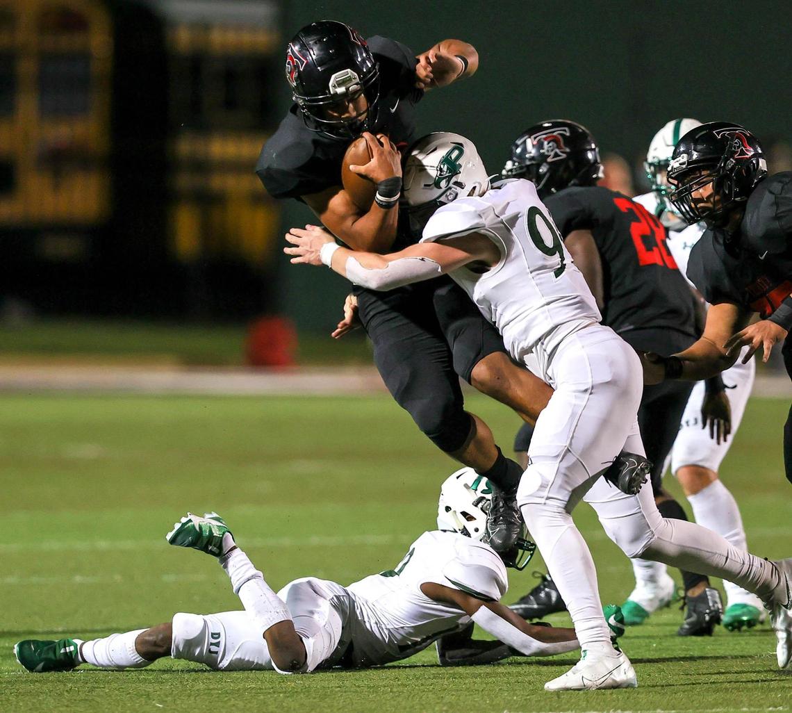 Trinity quarterback Valentino Foni (16) is stopped by Prosper defensive lineman Dylan Hinshaw (95) during the second half, Thursday night, October 1, 2020 played at Pennington Field. (Steve Nurenberg Special to the Star-Telegram)
