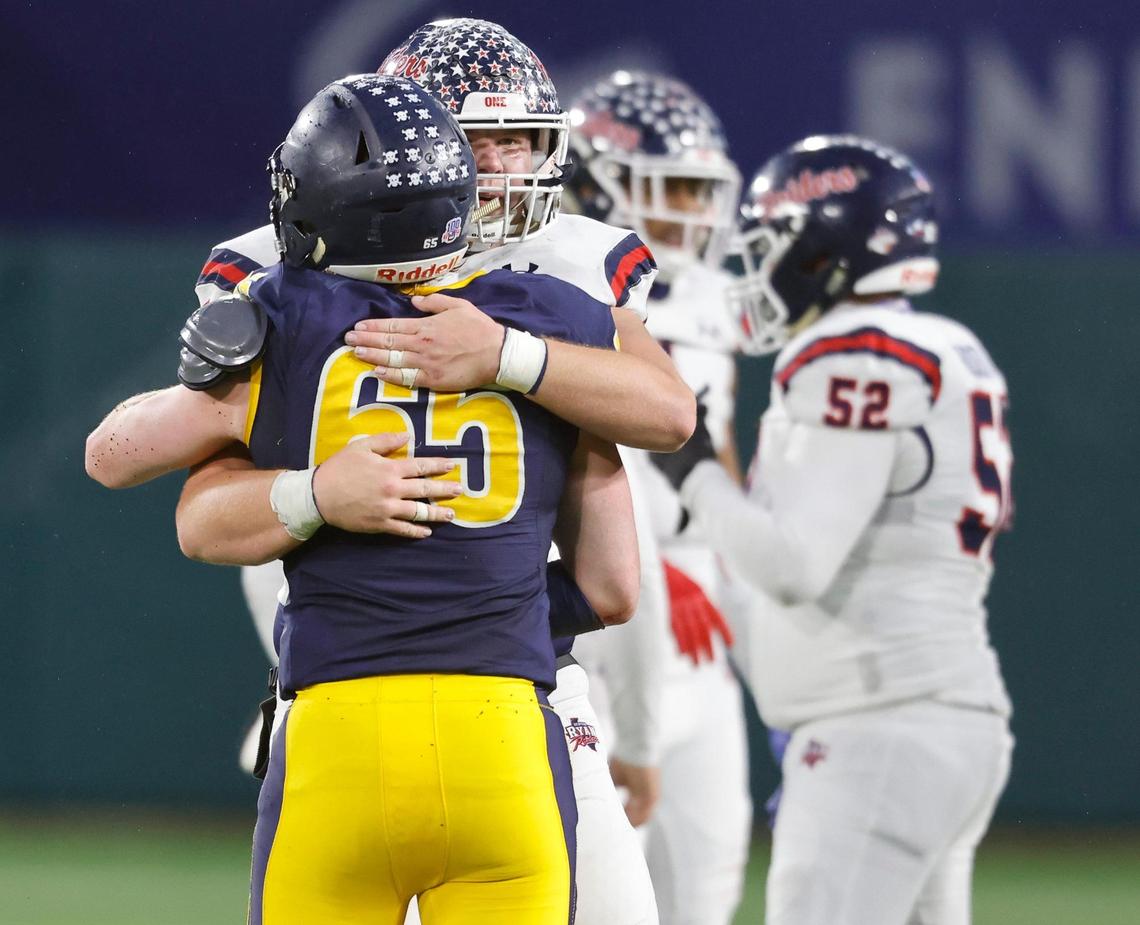 Denton Ryan offensive lineman Riley Hampton (77) embraces a Highland Park player in a show of sportsmanship after the 5A division 1 quarterfinals at Globe Life Park in Arlington, Texas, Friday, Jan. 01 2021. After a scoreless second half Denton Ryan defeated Highland Park 17-7. (Special to the Star-Telegram Bob Booth)