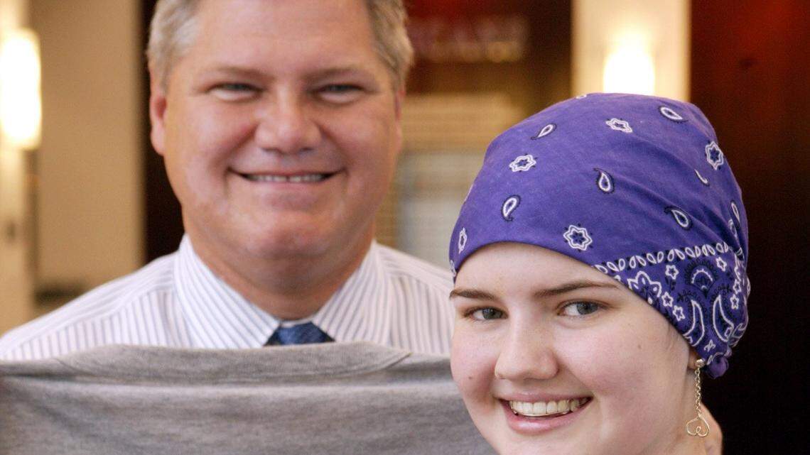 Longtime TCU assistant athletic director Jack Hesselbrock, with his late daughter Molly back in November 2004, when she was undergoing cancer treatments, is planning to leave the university as he battles a problem with his vision.