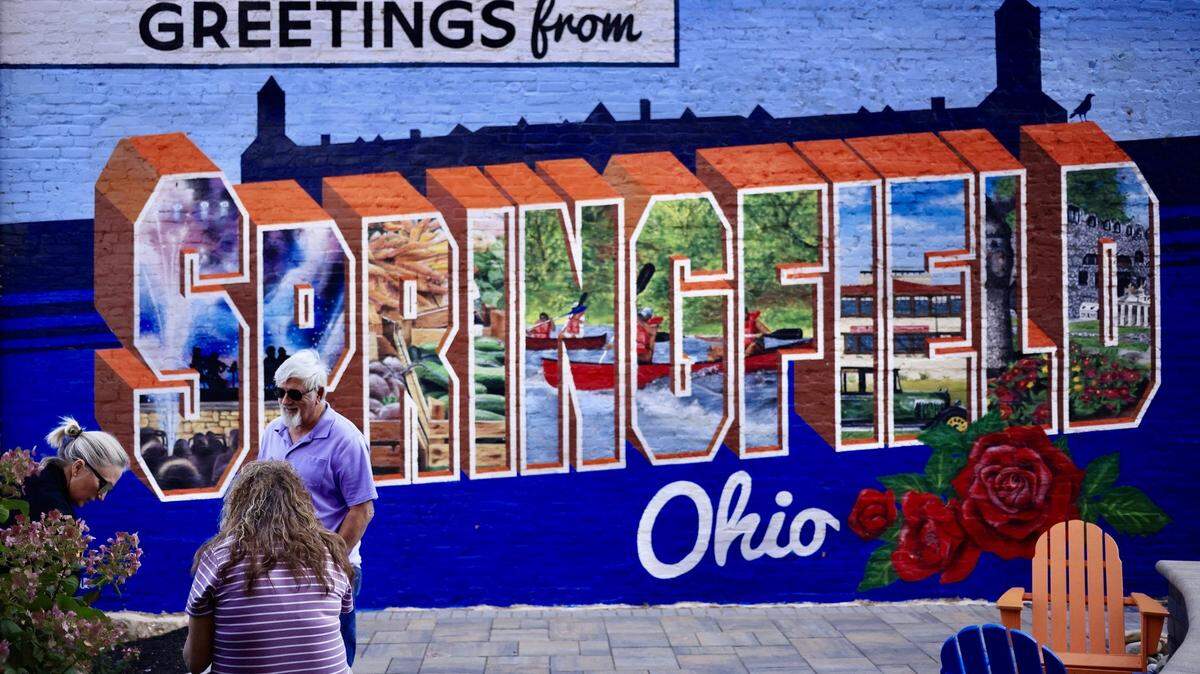 A mural is displayed in an alley downtown Springfield, Ohio, on Sept. 16, 2024. Springfield, home to a large Haitian community, was thrust into the national spotlight after former President Donald Trump made claims during the presidential debate against Vice President Kamala Harris, accusing members of the immigrant community of eating the pets of local residents. The claims have been called into question, and local institutions have faced multiple bomb threats.