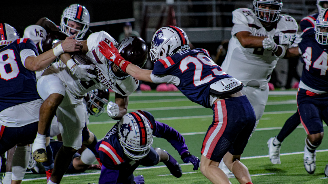 Richland defensive back Brayden Riffle (29) and a host of Royals defenders try to bring down Mansfield Timberview running back Jaylon Woods Friday, October 27, 2023, at Birdville Fine Arts/Athletics Complex in North Richland Hills.