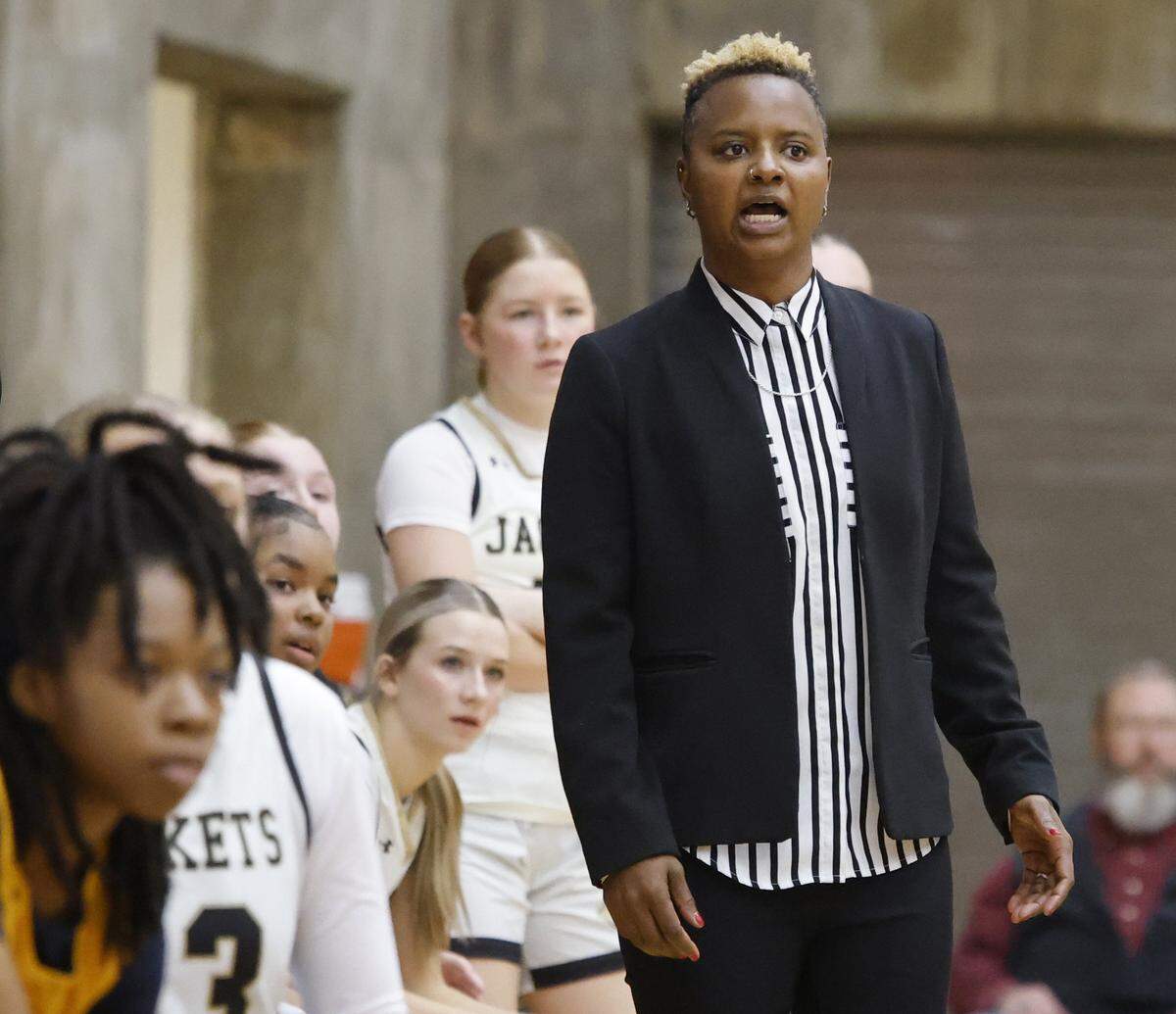 Cleburne head coach Tiffany Hill watches her teams offensive against Arlington Heights during the first half of the UIL 5A D1 girls bi-district championship basketball game at Wilkerson Greines Activity Center in Fort Worth, Texas, Monday Feb. 16, 2026.