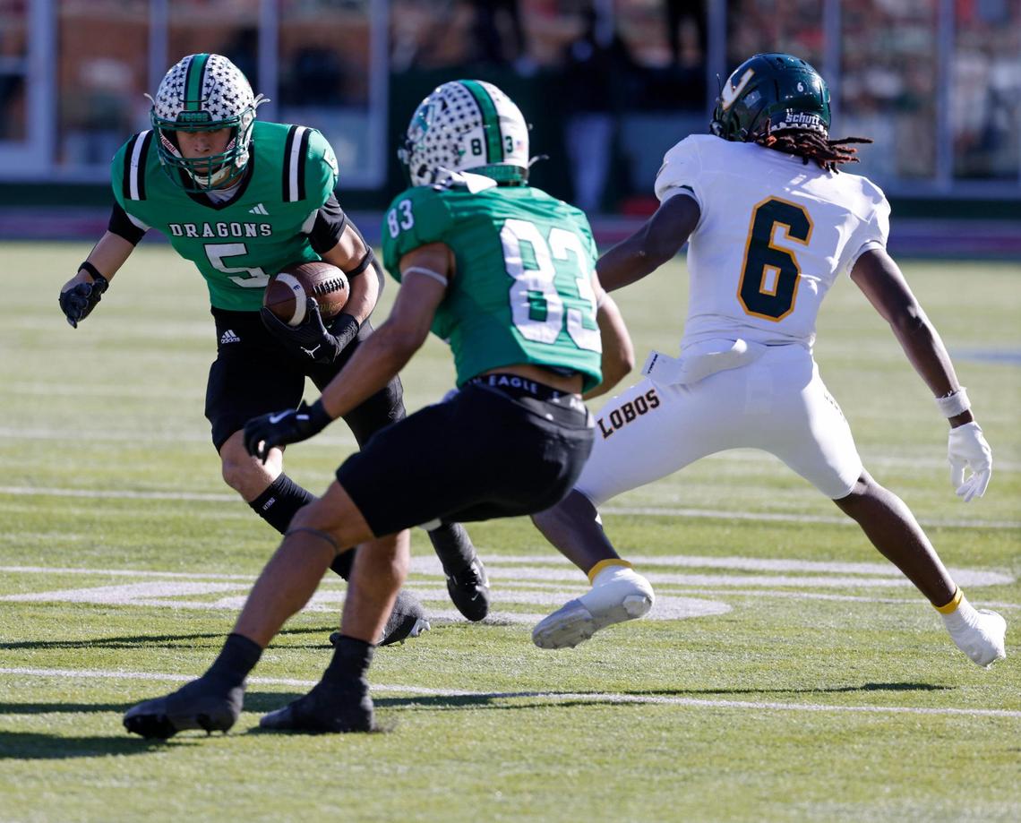 Southlake Carroll wide receiver Blake Gunter (5) crosses in front of his blocker, running back Christian Glenn (83), against Longview during the UIL 6A D2 Semifinals football game at Gerald J. Ford Stadium in University Park, Texas, Saturday, Dec. 14, 2024.