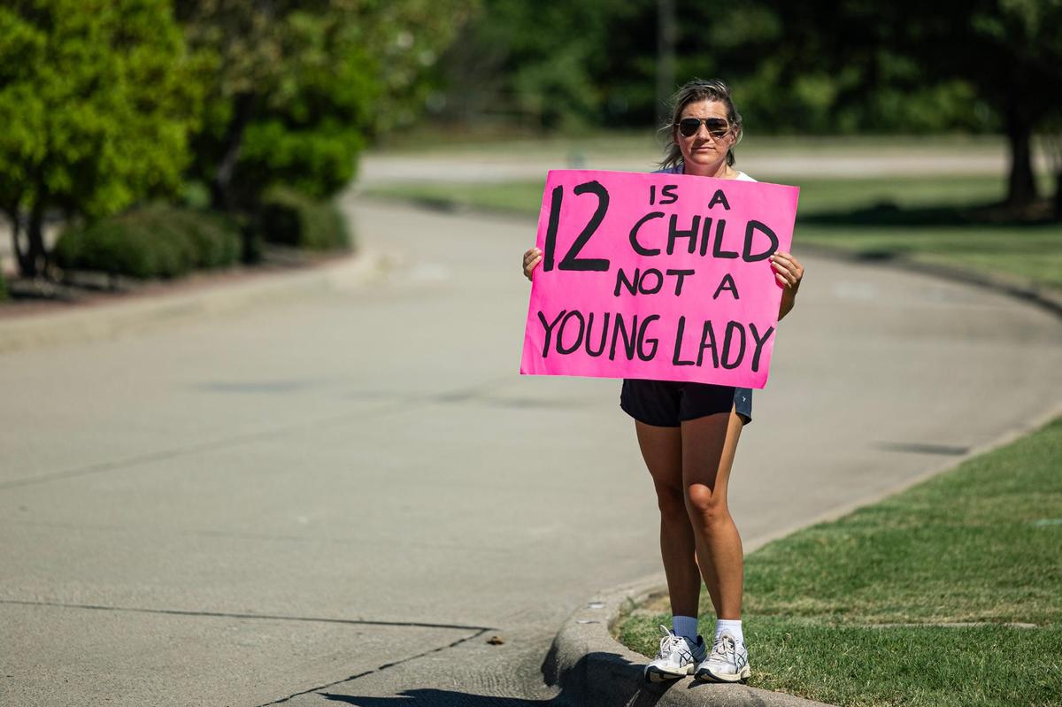 Megan Thompson holds a sign in protest of child and sexual abuse in the church outside of Gateway Church in Southlake on Saturday, June 22, 2024.