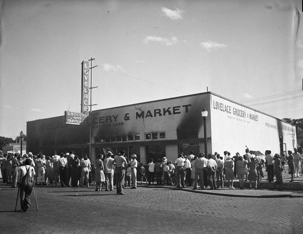 June 29, 1941: A fire swept through the Lovelace Grocery and Market late Sunday afternoon. Pictured is the singed exterior of the store. A crowd of people gathered around the building to inspect the damage. The ceiling collapsed and the equipment and contents were scorched. The walls were the only thing left intact. The cause of the fire was not determined, but Fire Marshal Ligon estimated the loss at $25,000. (The site, 1503-09 N. Main St. at N.W. 14th Street, is home today a convenience store and laundry shop.)