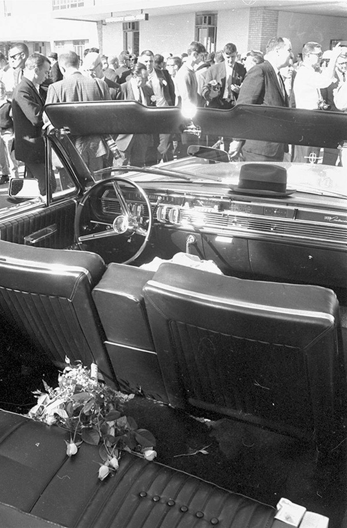 Nov. 22, 1963: The empty limousine with flowers on the back seat outside Parkland Hospital following the President John F. Kennedy assassination.