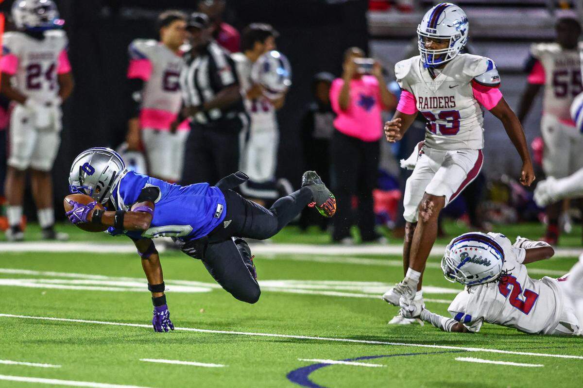 Fort Worth Eastern Hills receiver Detavian Bates dives for a first down against Fort Worth Southwest on Thursday, Oct. 17, 2024 at Scarborough-Handley Field in Fort Worth, Texas.
