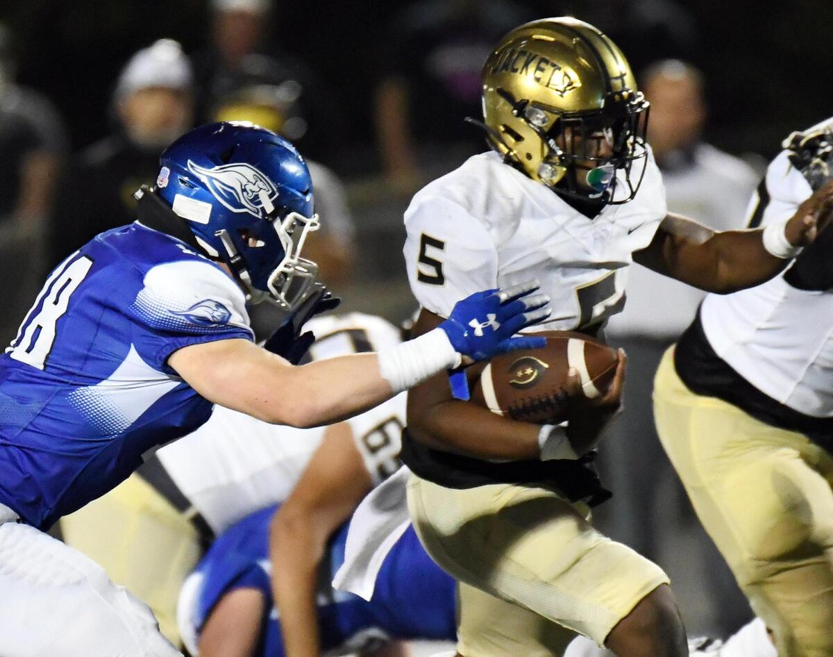 Cleburne’s Cleo Chandler, right breaks away from Weatherford’s Koby Kidd, for a touchdown to take a 41-24 lead in the fourth quarter of their football game Friday, October 9, 2020 at Kangaroo Stadium in Weatherford, Texas.Cleburne won 48-31. Special/Bob Haynes