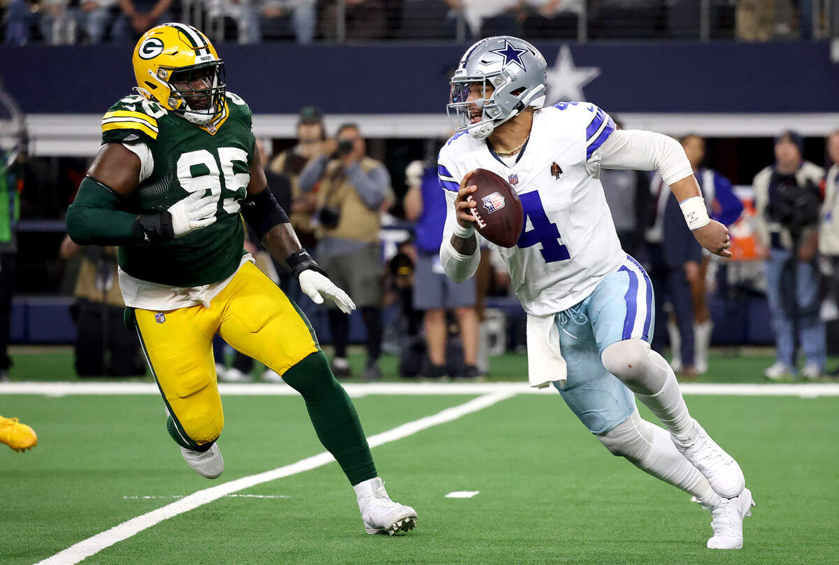 Green Bay Packers defensive lineman pursues Dallas Cowboys quarterback Dak Prescott onSunday January 14, 2024.