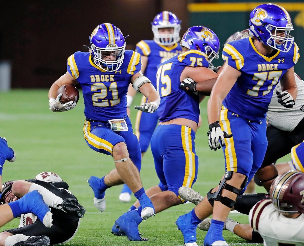 Brock running back Kutter Wilson (21) jumps through the middle during a high school Class 3A Division 1 Quarterfinals playoff game at Globe Life Field in Arlington, Texas, Thursday, Dec. 02, 2021. Brock led 28-0 at the half. (Special to the Star-Telegram Bob Booth)