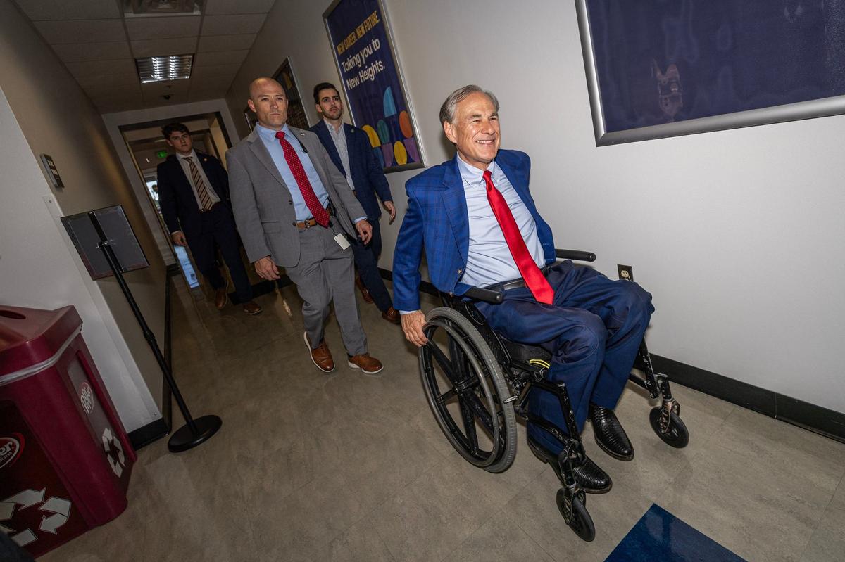 Texas State Governor Greg Abbott arrives for the grand opening ceremony of the New Heights Adult High School at the Tarrant County College Opportunity Campus in Fort Worth on Wednesday, Sept. 25, 2024. New Heights is the first dual enrollment adult high school in Texas.