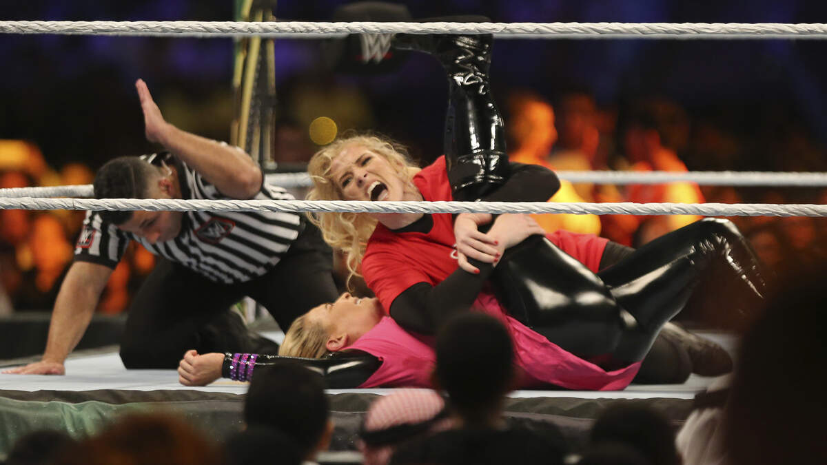 WWE stars Lacey Evans, top, takes down Natalya Neidhart during the first-ever women’s wrestling match in October. Monday Night Raw, which was scheduled to air live from Dickies Arena on March 23, has been rescheduled for July 31.
