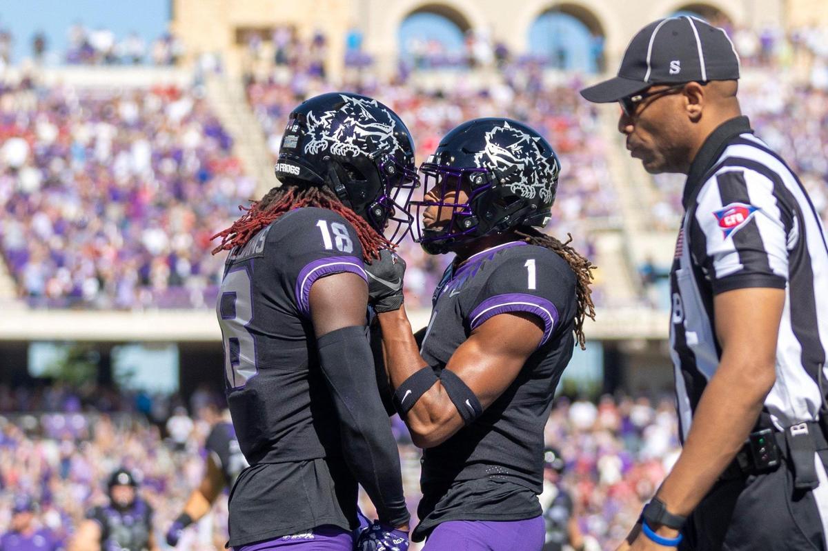 TCU wide receiver Savion Williams and TCU wide receiver Quentin Johnston celebrate after Williams scores a touchdown during their game against OU at the Amon G. Carter Stadium in Fort Worth, Texas, on Saturday, Oct. 1, 2022.
