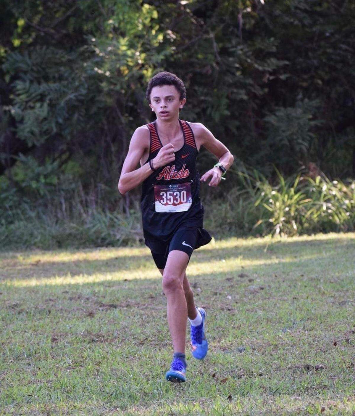 Aledo freshman Jack Fink runs at the district JV cross country meet. He won first place.