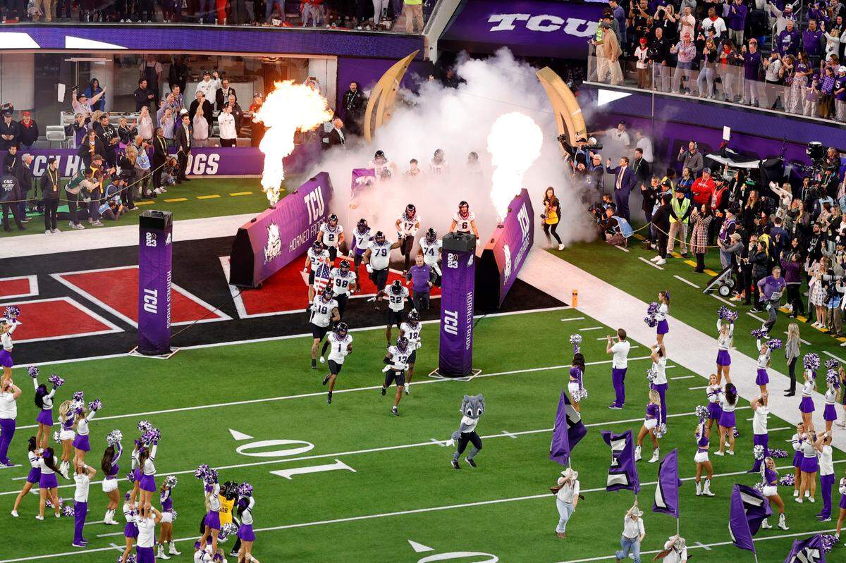 TCU runs onto the field ahead of their game against Georgia in the College Football Playoff National Championship on Monday, Jan. 9, 2023, in Inglewood, Calif.