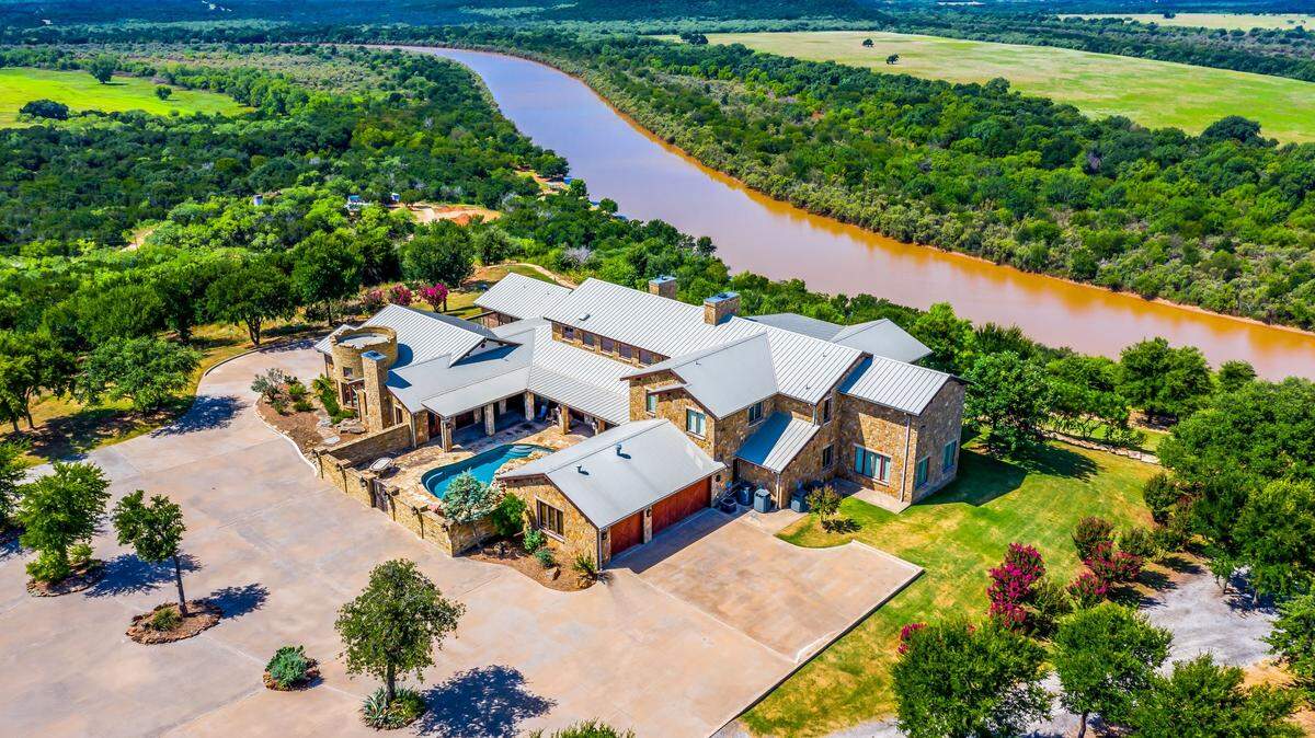 The home at 1300 Herron Bend Road sits on a hilltop near the apex of the Herron Bend of the Brazos.