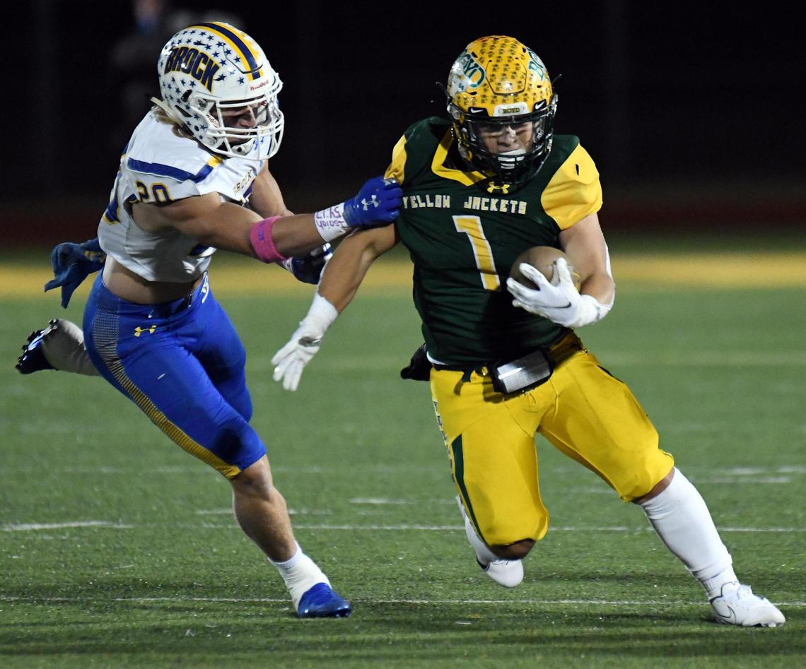Brock’s Luke Dillingham, left grabs Boyd’s Caleb Armijo as he scrambles out of the backfield in the second quarter of their District 4-3A football game Friday, October 23, 2020 at Yellowjacket Stadium in Boyd, Texas. Special/Bob Haynes