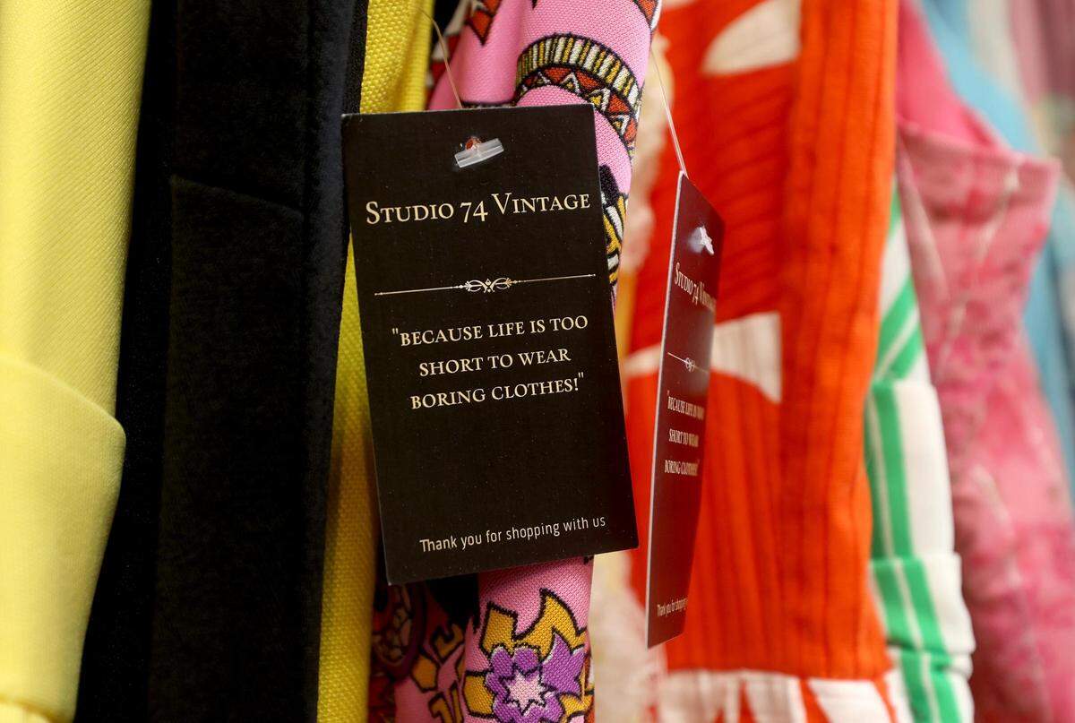 Vintage clothing hangs from a rack at Studio 74 Vintage in Fort Worth on Thursday, December 23, 2021. Laura Simmons is the owner of the boutique shop that sells curated vintage clothing.