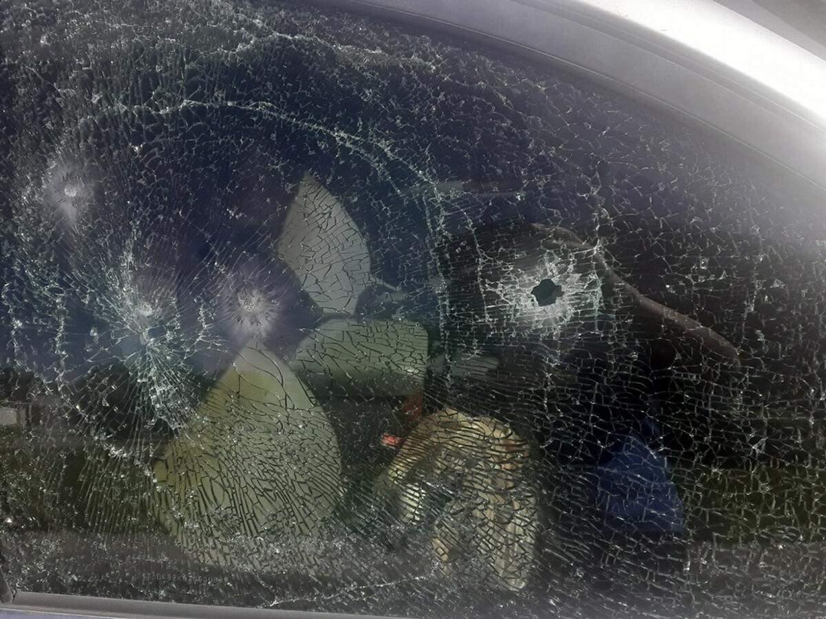 A carjacking suspect shot through her car windows several times hitting her at least once in the head on Tuesday, a shooting victim said.  