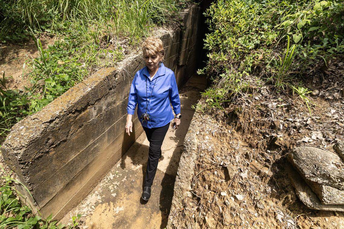 Curator and historian Vickie Bryant walks out of one of the multiple escape tunnels coming out of the historic Top O' Hill Terrace casino and speakeasy on Wednesday, July 16, 2025. 
