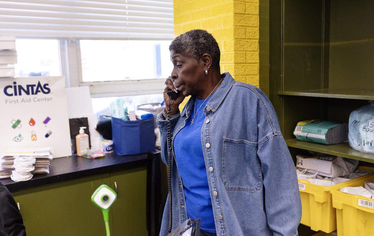 Executive coordinator Karen Smith takes a call while working to distribute food and other resources to those in need at the Community Food Bank of Fort Worth on Monday, Nov. 10, 2025.