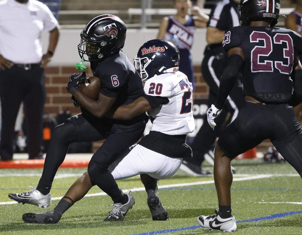 Ryan defensive back Temperance Epps (20) grabs Timberview wide receiver Dayln Hill (6) in the backfield during the second half of a UIL football game at Vernon Newsom Stadium in Mansfield, Texas, Thursday, Sept. 04, 2025.