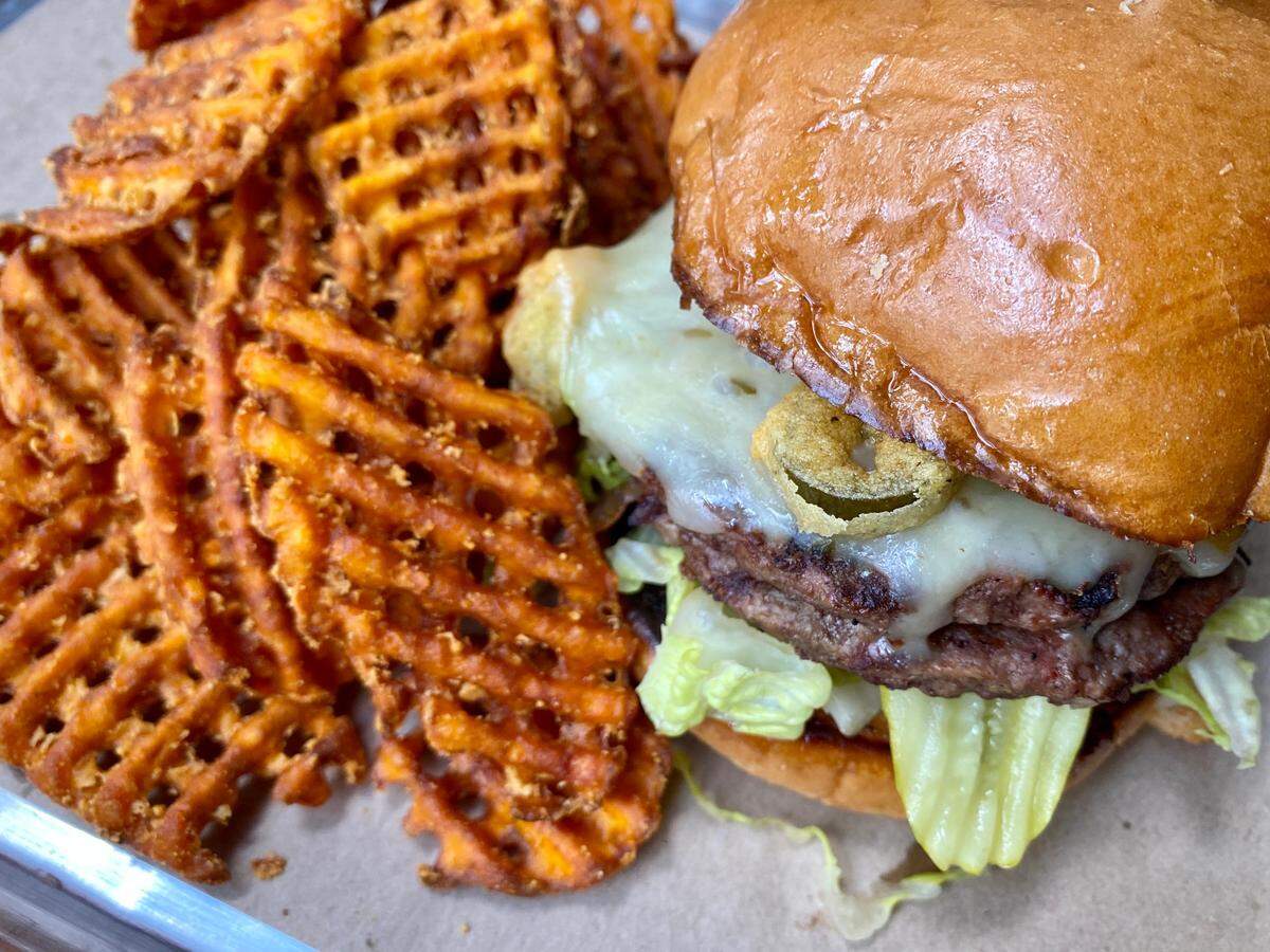 A cheddar-Jack burger with jalapenos at the Billy Bob’s Texas Honky Tonk Kitchen.