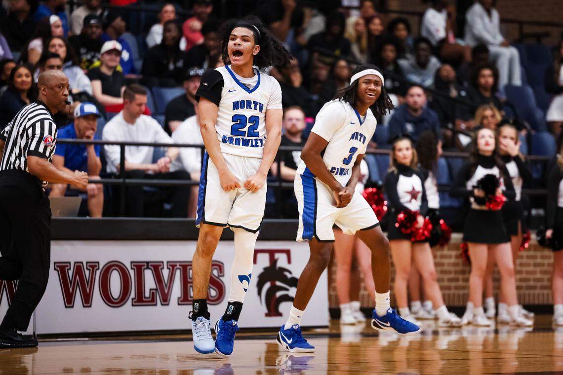 North Crowley guard Isaak Hayes (22) jumps in the air and screams in celebration alongside his teammate Donte Grandberry (3) in a UIL 6A D1 regional semifinal at Timberview High School in Arlington, Texas, Tuesday, March 3, 2026.