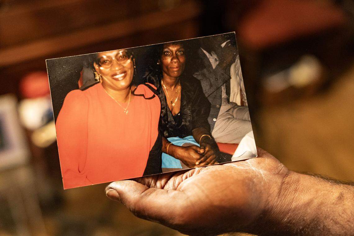 Scotti Choice holds a photo of his mother, Gloria Choice, at his house in Fort Worth on Nov. 8, 2025. Gloria was found beaten to death in a vacant apartment at 5816 Boca Raton Blvd. on Dec. 9, 2005. A suspect was arrested in 2012, but police released him a short time later for lack of evidence.