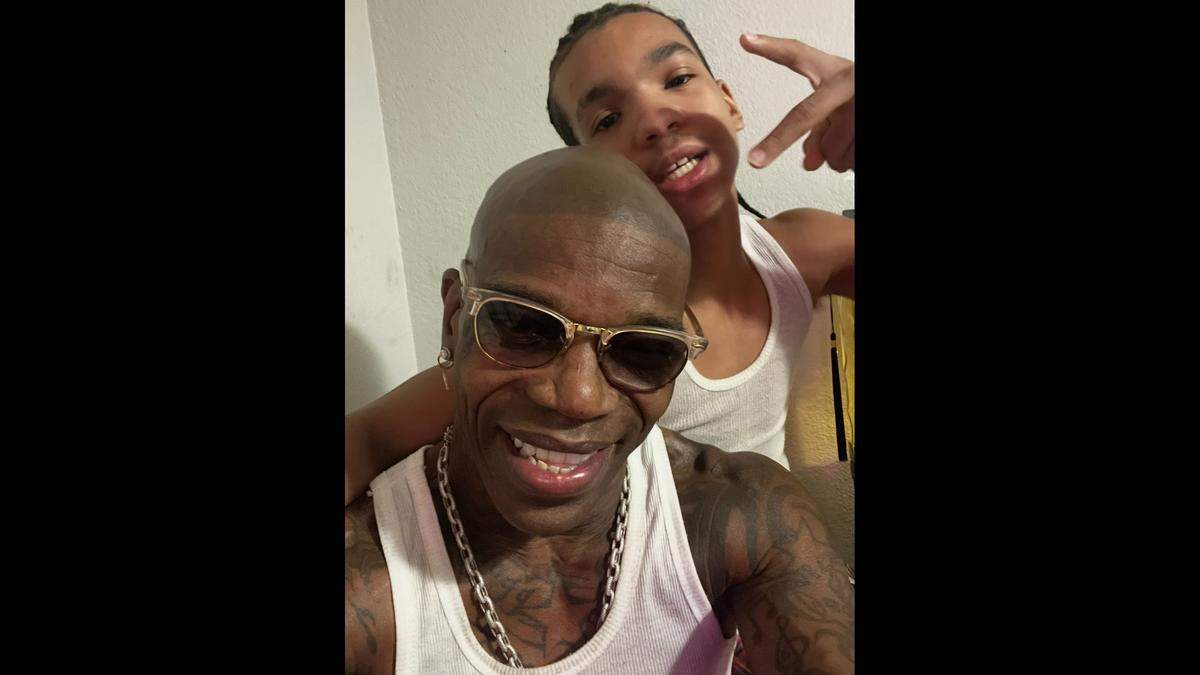 Prince Semaj Washington, 15, and his father, James Washington, pose for a photo on Dec. 30, 2025.