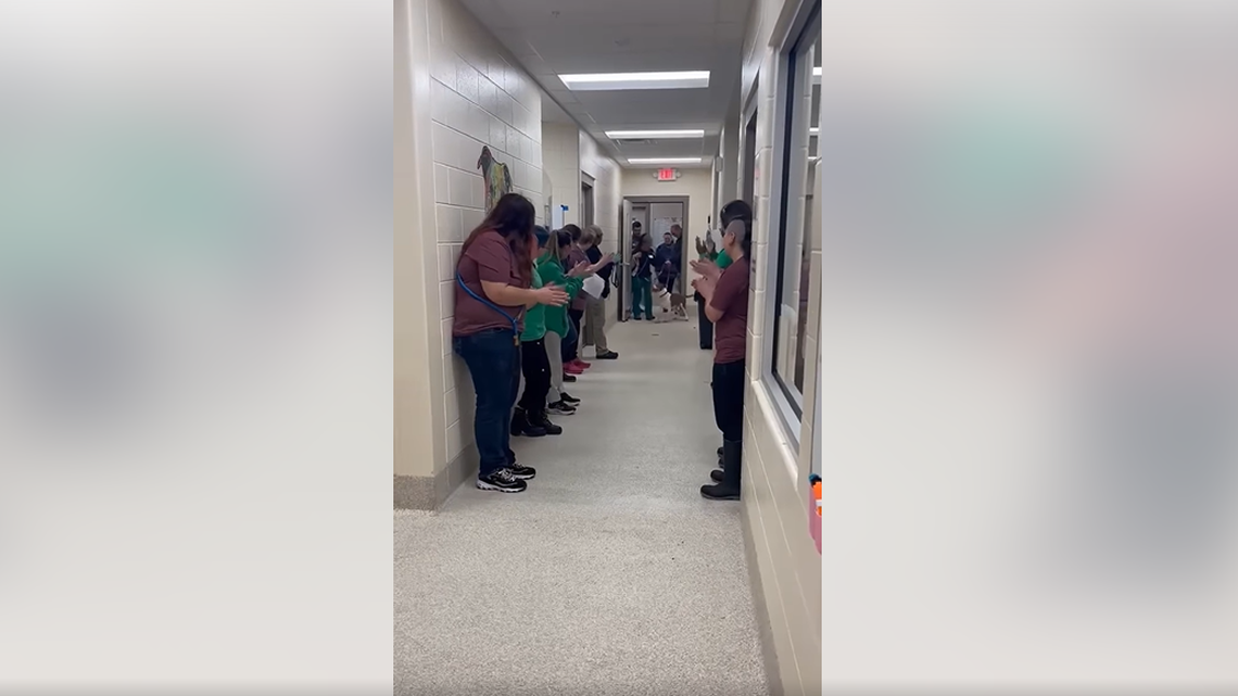 Staff line the hallway to give Yankee a send-off.