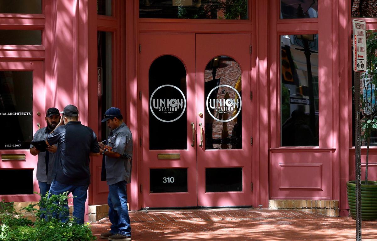 Sundance Square employees work outside of Union Station in downtown Fort Worth. Patrick McGrew, who owned the record store and custom shoe shop, announced on Instagram he was walking away from the business.