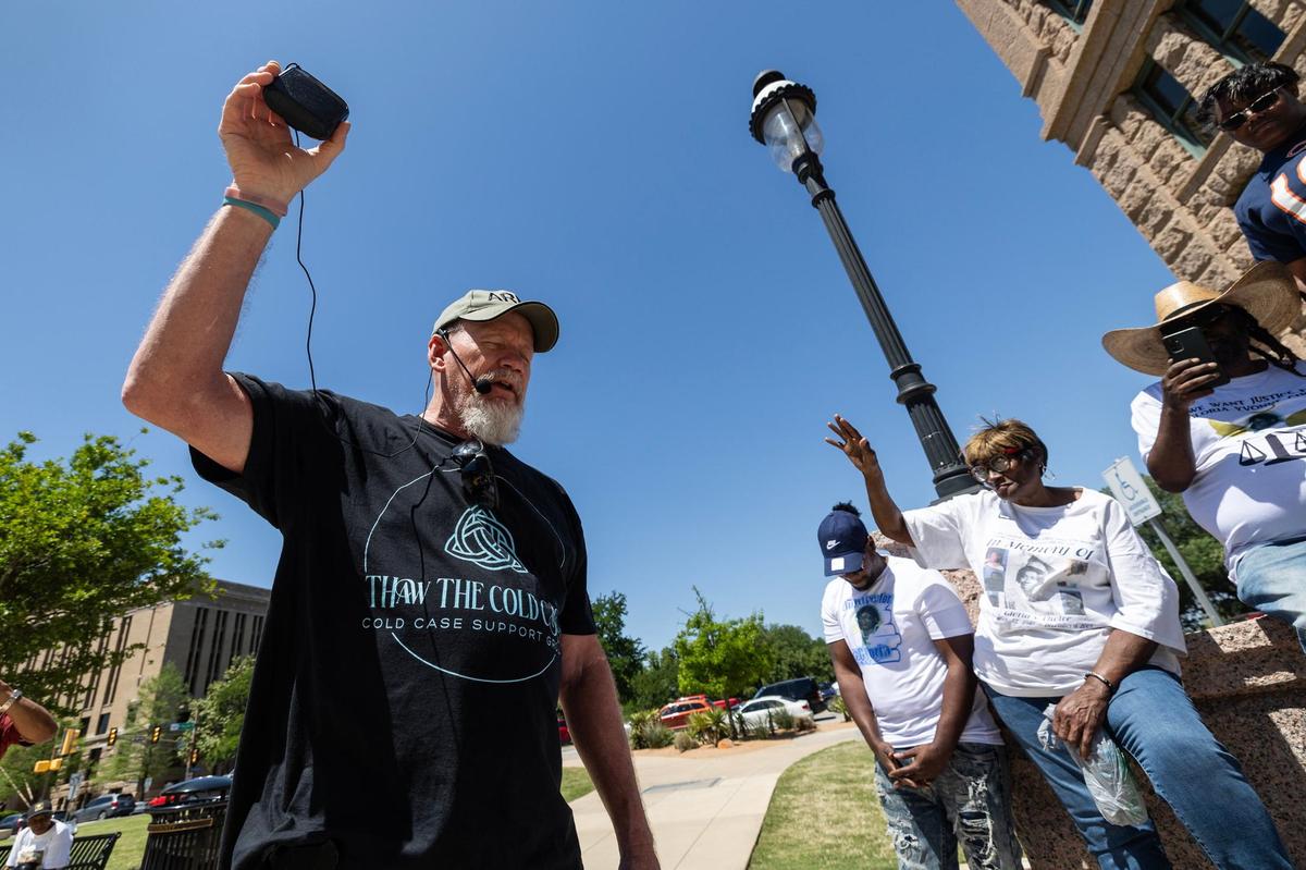 Carla Walker’s brother, Jim Walker, says a prayer to the families gathered during a cold case rally in front of the Tarrant County Courthouse in downtown Fort Worth on April 13, 2024. The Fort Worth Police Department has about 1,000 unsolved cold cases.