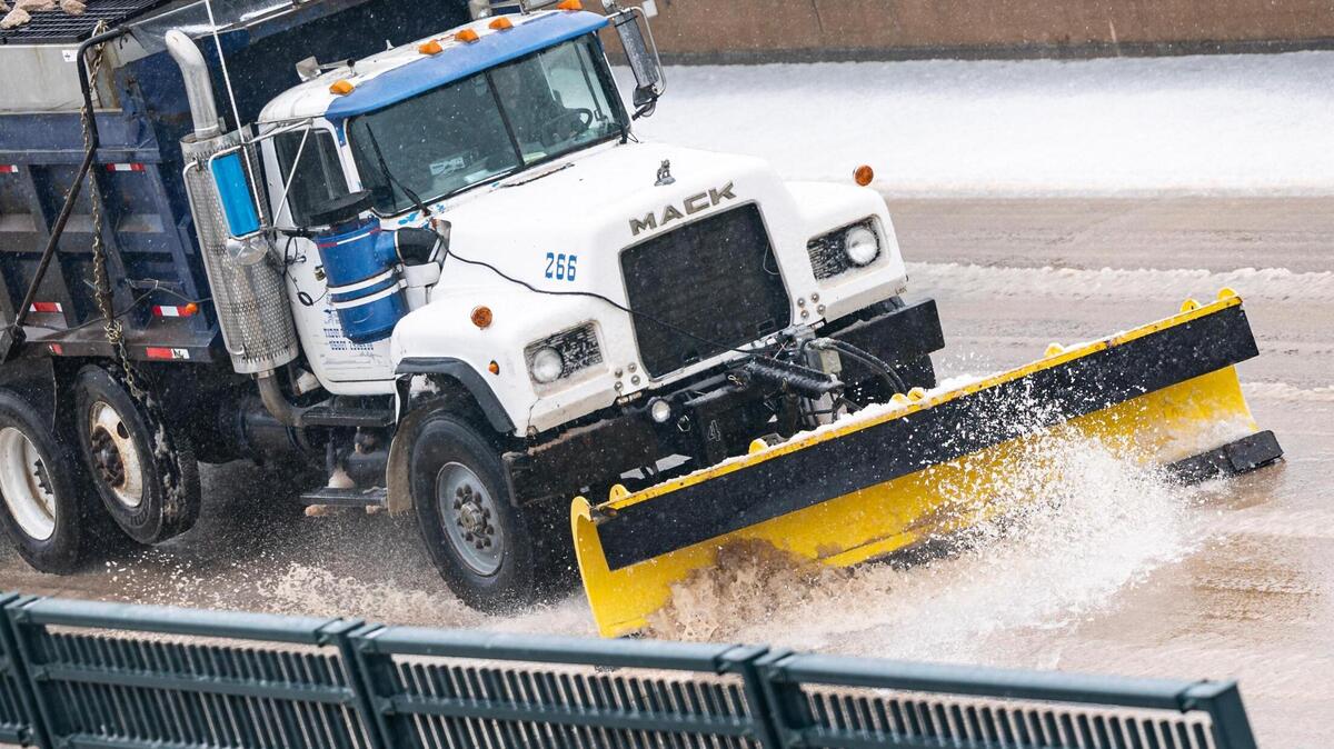 A snow plow truck shovels snow off to the sides of the road on the Chisholm Trail Tollway in Fort Worth on Thursday, Jan. 9, 2025.