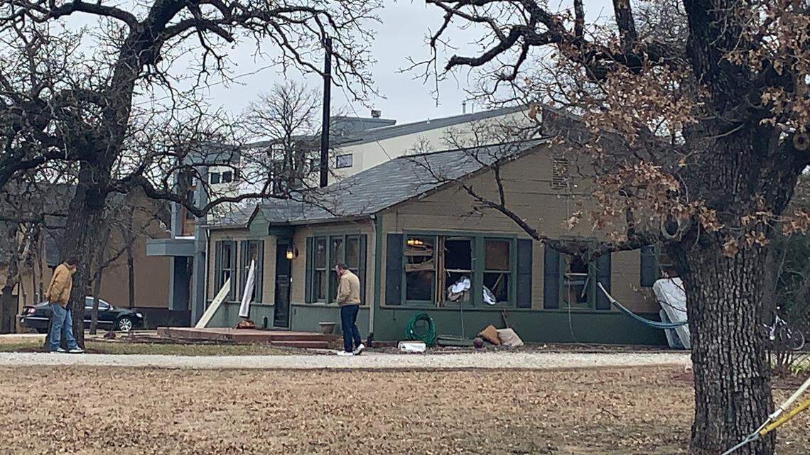 An identity theft ring was broken up Thursday when police and federal agents raided this home in south Keller and arrested seven people, police say. Police were still at the scene late Thursday morning investigating.