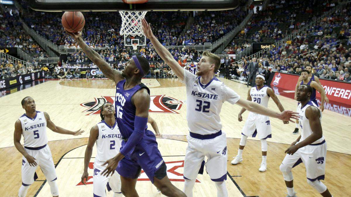 TCU's JD Miller puts up a shot during the first half against Kansas State in the Big 12 Conference tournament Thursday afternoon in Kansas City, Mo. The game was tied at 30-30 at halftime. , March 8, 2018, in Kansas City, Mo.
