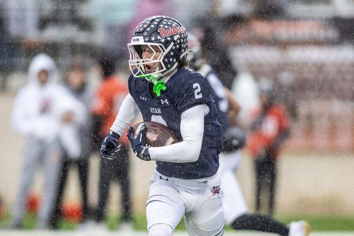 Denton Ryan’s Braeden Mussett (2) runs the ball after a catch against Aledo in a Class 5A Division 1 state quarterfinal on Saturday, Dec. 7, 2024 at Crowley ISD Multi-Purpose Stadium in Fort Worth, Texas.