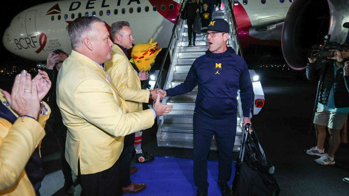 Michigan coach Jim Harbaugh is welcomed to Phoenix for the Vrbo Fiesta Bowl.