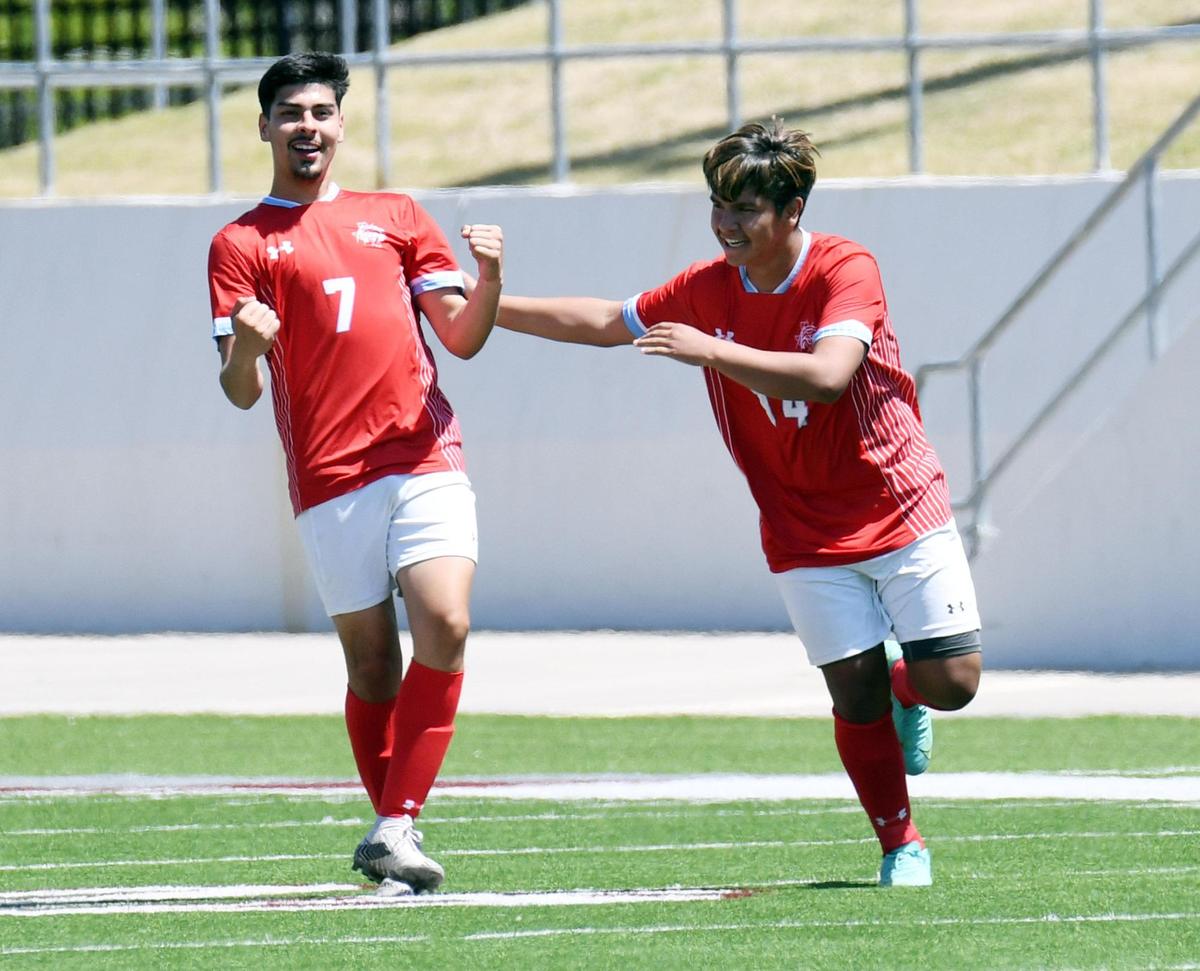Castleberry’s Esteban Mercado, left, celebrates with Jose Chairez after scoring a goal to tie Stephenville 2-2 in the first half of the Region 1-4A boys soccer final Saturday, April 9, 2022 at Northwest ISD Stadium in Justin Texas. Stephenville went on to win 5-2. Special/Bob Haynes