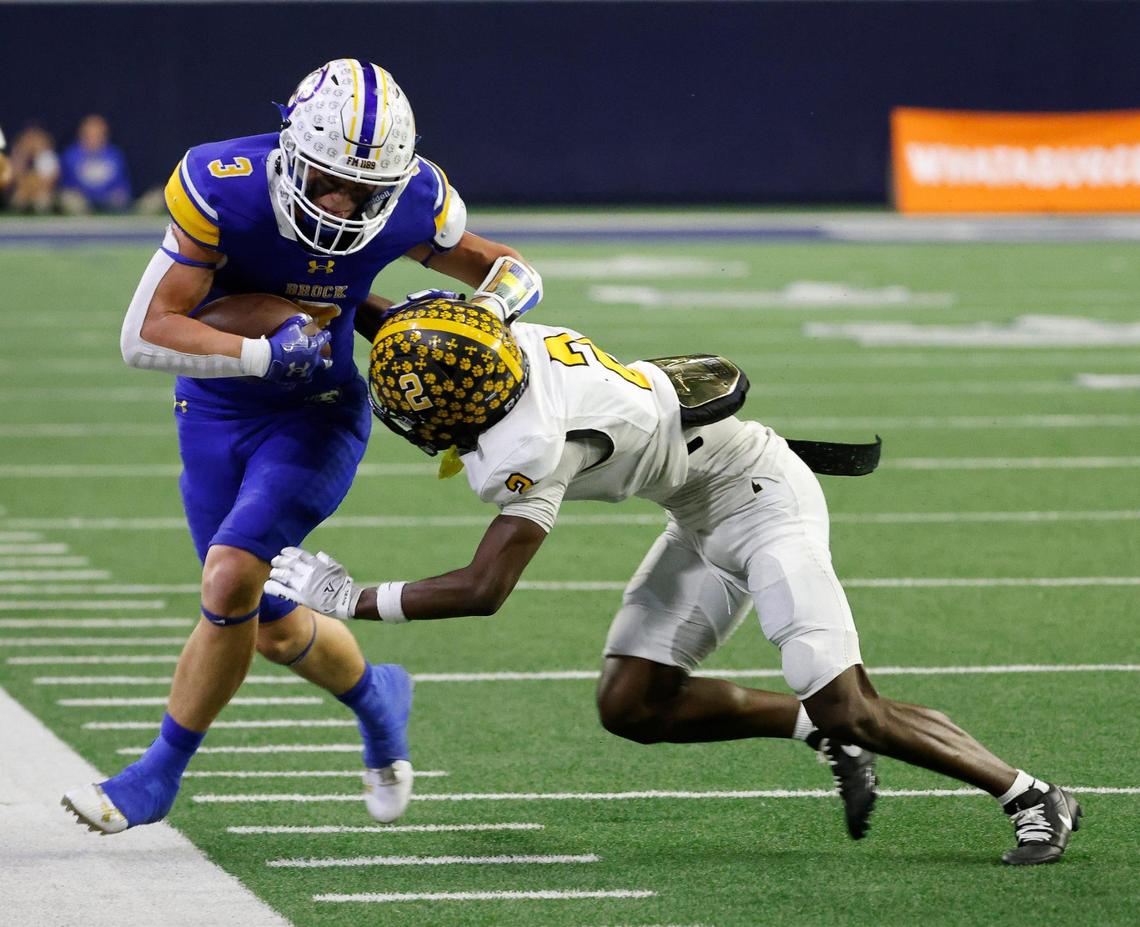 Brock wide receiver Carson Finney (3) is taken out of bounds by Malakoff defensive back Chauncey Hogg (2) after a catch during the first half of a UIL Conference 3A Division 1 semifinal playoff football game at The Ford Center in Frisco, Texas, Thursday, Dec. 07, 2023.