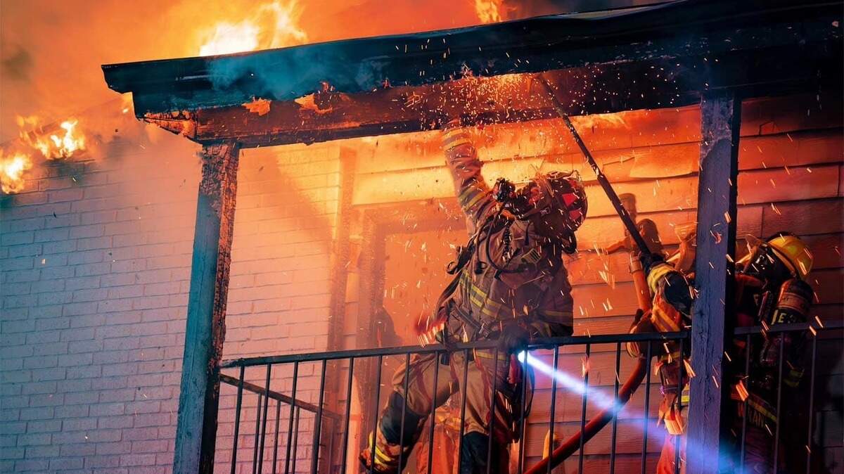 Fort Worth firefighters work to put out a fire at an apartment building on Saturday.