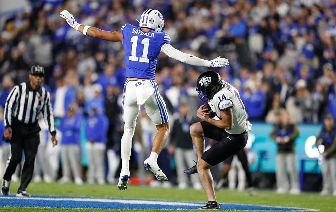 PROVO, UT - NOVEMBER 15: Joseph Manjack IV, #14 of the Texas Christian University Horned Frogs makes a catch under Faletau Satuala #11 of the Brigham Young Cougars during the first half of their game at LaVell Edwards Stadium on November 15, 2025 in Provo, Utah. (Photo by Chris Gardner/Getty Images)