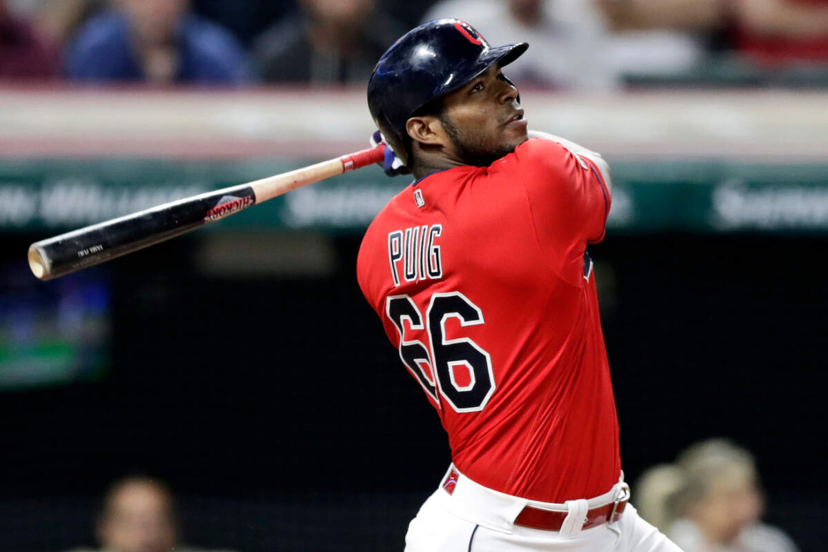In this Sept. 18, 2019, file photo, Cleveland Indians’ Yasiel Puig watches his ball after hitting the game-winning RBI-single in the 10th inning in a baseball game against the Detroit Tigers in Cleveland.