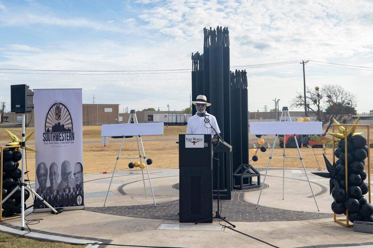 Blake Mormon, a member of Alpha Phi Alpha, commemorates the life of fellow member Reby Cary in Fort Worth, Texas, on Saturday, July 30, 2022. Cary was a local leader in education and civil rights.