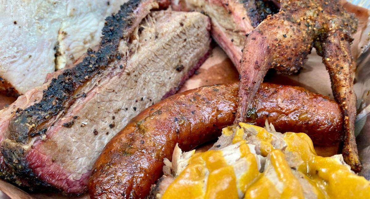 Turkey, brisket, quail, sausage and pulled pork with mustard sauce at Hurtado Barbecue.