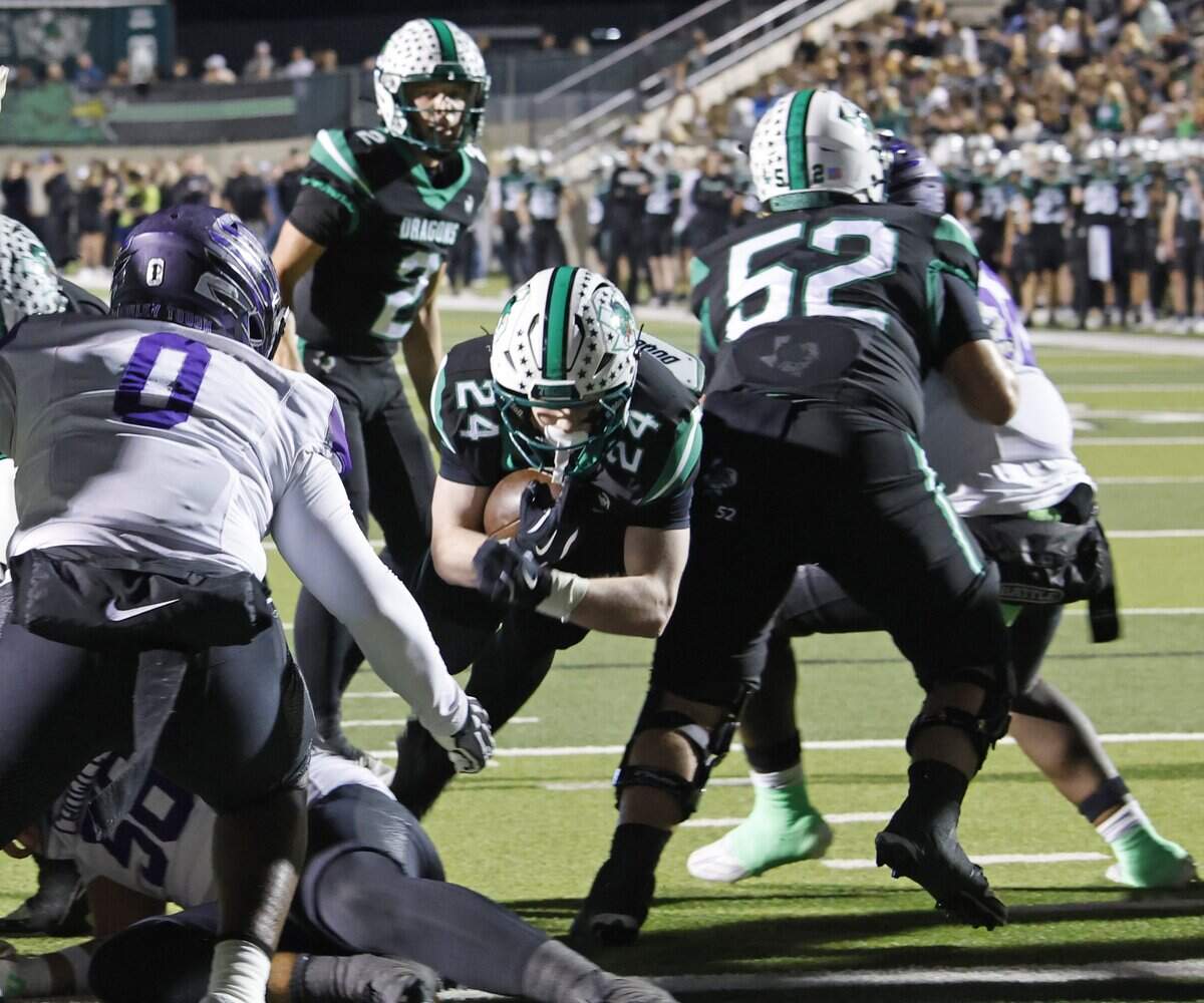 Southlake wide receiver Brock Boyd (1) finds the hole to score during the first half of a UIL Conference 6A D2 Bi-District playoff game between Crowley and Southlake Carroll at Dragon Stadium in Southlake, Texas, Thursday, Nov. 13, 2025.