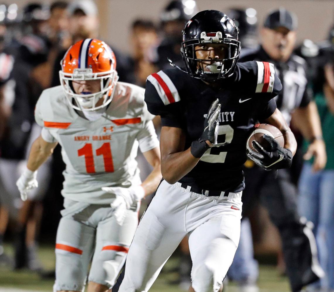 Trinity running back Ollie Gordon (2) outruns San Angelo Central cornerback David Mier (11) during the first half of a high school football game at Pennington Field in Bedford, Texas, Friday, Oct. 04, 2019. Trinity led 28-17 at the half. (Special to the Star-Telegram Bob Booth)